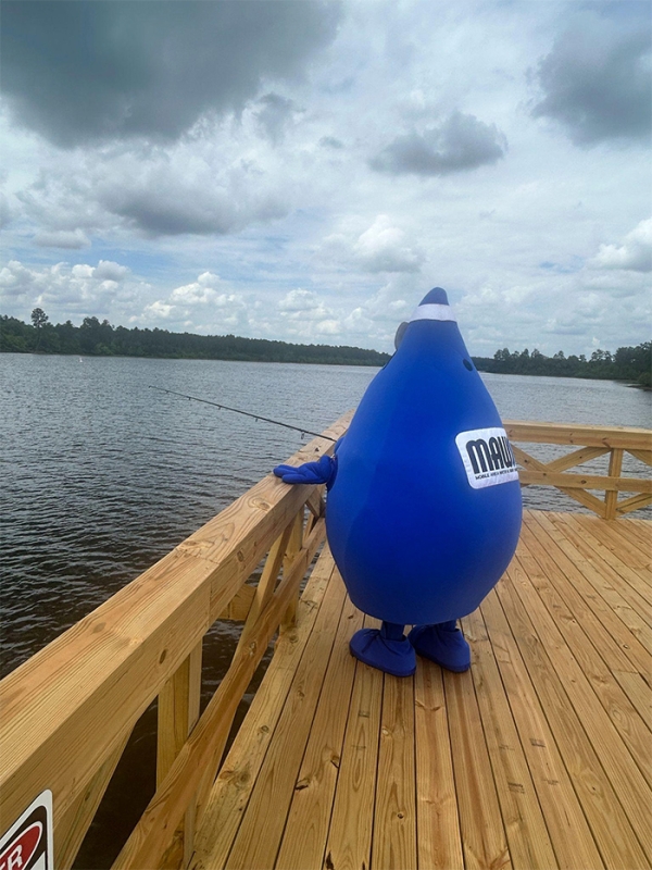 MAWSS water drop character fishing off pier